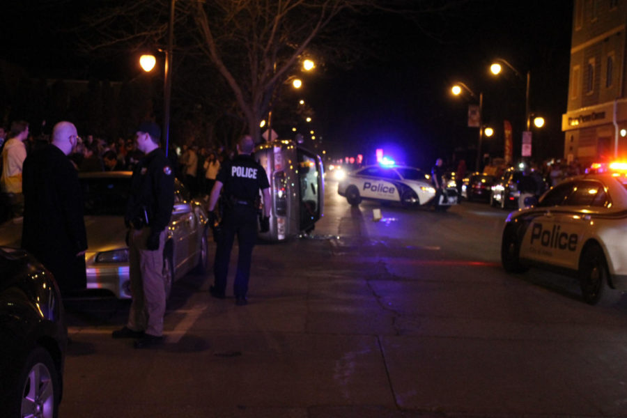 Police work on trying to control the crowd on Welch Avenue after a large crowd flipped a car over April 8. 