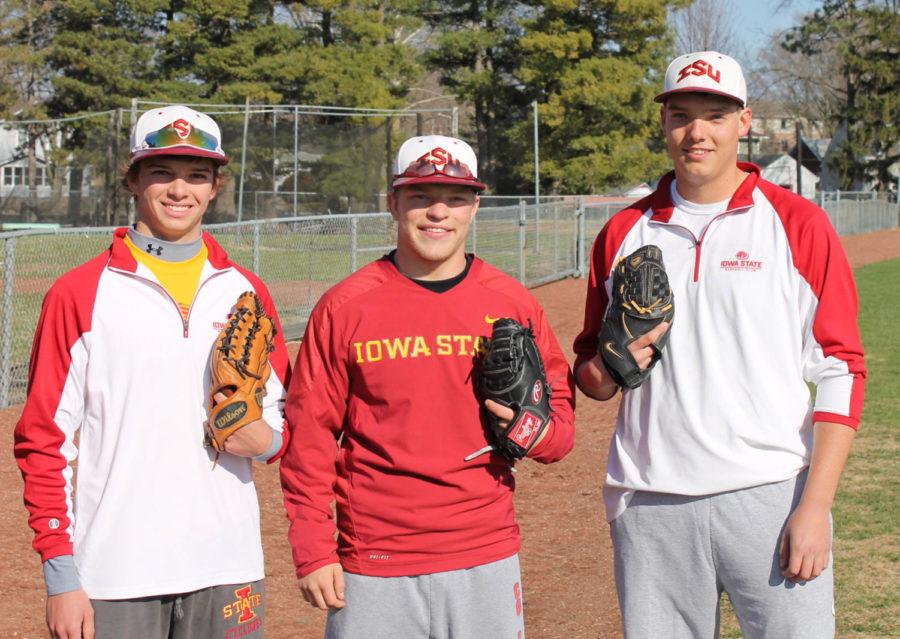 Justin Kelm, Matt Odland and Troy Kettwick, freshman on the club baseball team at Iowa State, prepare for practice at Cap Timm Field on April 15.
