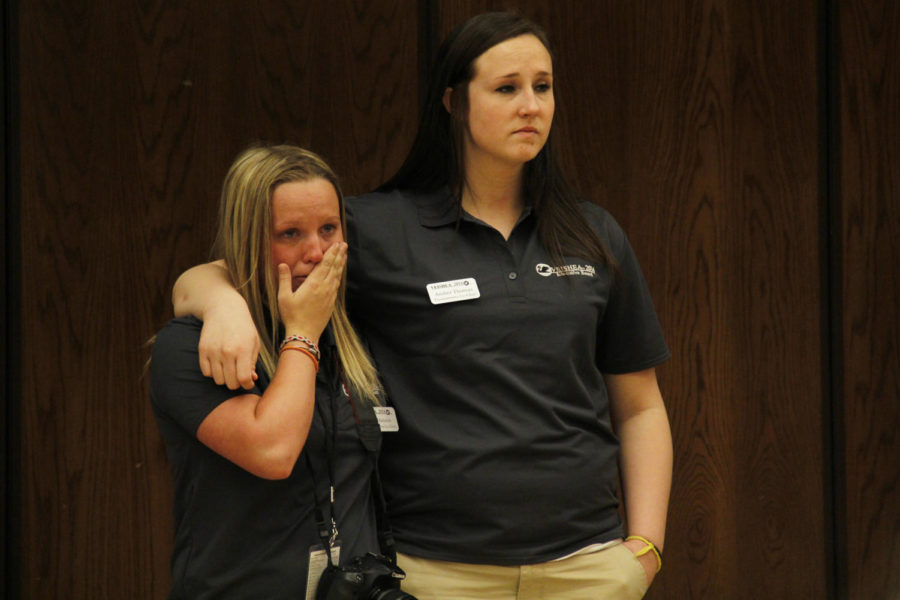 Katie Hansen, left, senior in journalism and mass communication, and Amber Thomas, senior in accounting, both Veishea committee members, cry in reaction to President Steven Leaths announcement suspending Veishea as a result of April 8s riot.