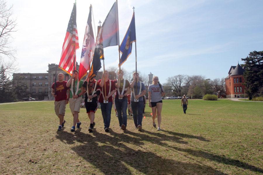 Members+of+ROTC+ran+through+their+Change+of+Command+ceremony+April+21+on+Central+Campus.+Color+guard+members+hold+the+flags+and+await+orders+during+the+run-through.