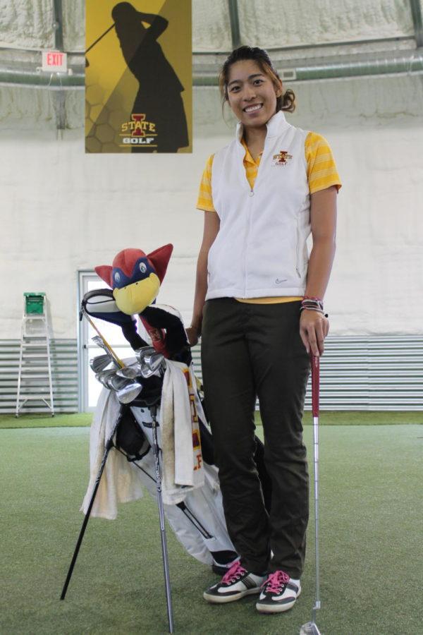 Prima Thammaraks, senior from Thailand, in the new Iowa State Golf Performance Facility south of campus. 