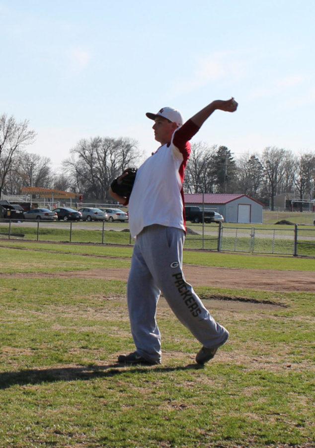 Troy Kettwick throws a baseball at Cap Timm Field south of campus on April 15. 