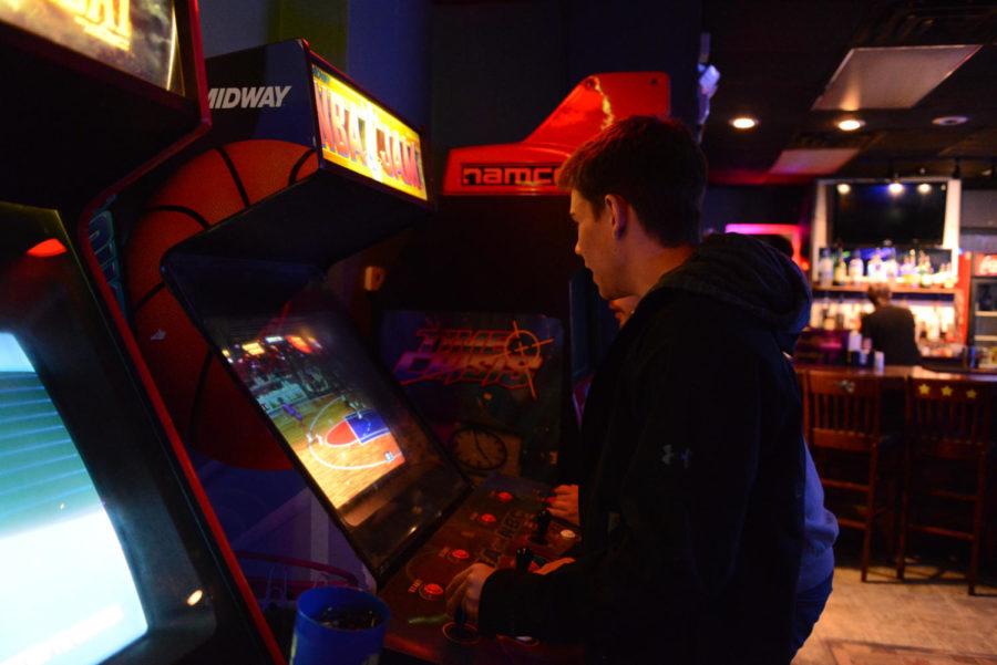 Jared Watters, senior in horticulture, and Andrew Dayton, senior in environmental science, play arcade games on May 1 at Score!