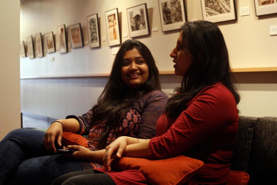 Monalisa Pati, right, and Devanshi Mehta, left, talk in the Multicultural Center on Wednesday. Pati, a graduate student in community and regional planning, and Mehta, Masters in Business Administration, are International Students who are staying in this Ames this summer.