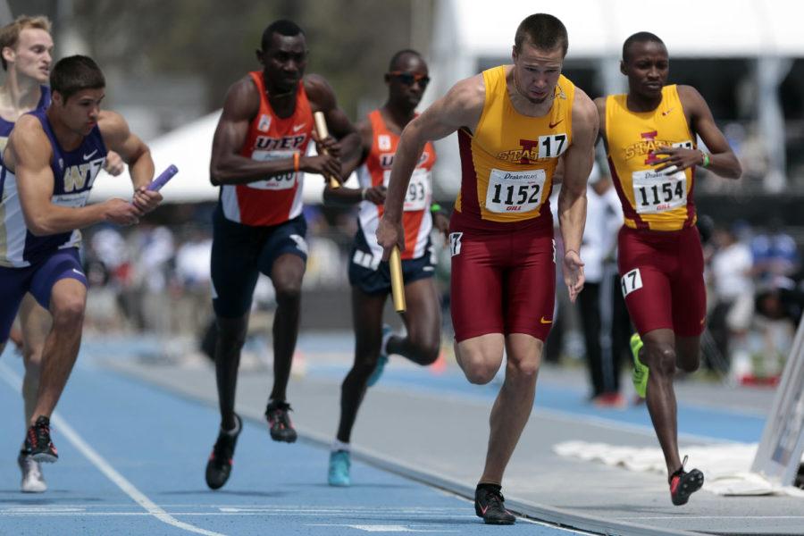 Freshman Derek Jones receives the baton from his teammate during the mens distance medley at the Drake Relays on April 26 at Drake Stadium. Iowa State came in fourth with the time of 9:47.12.