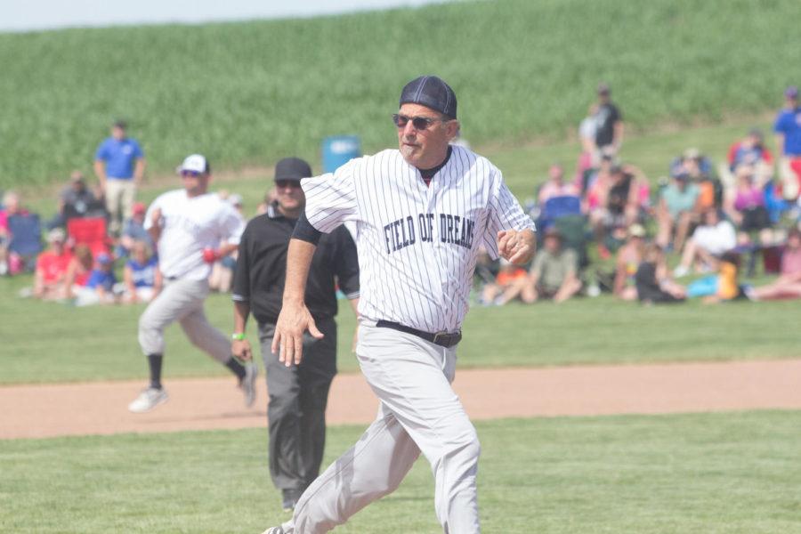 Kevin Costner runs toward third base in a celebrity softball game at the 25th anniversary of the movie Filed of Dreams in Dyersville, Iowa, on June 14.