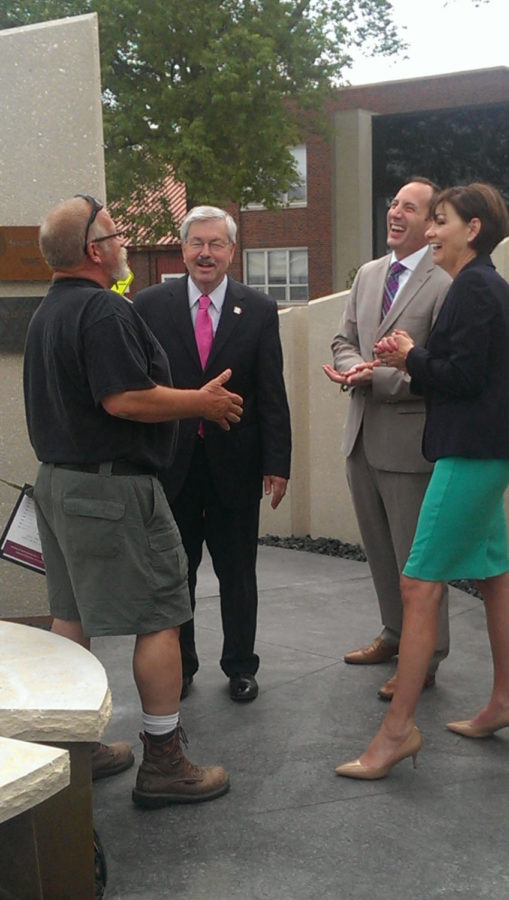 Gov. Branstad, Paul Trombino, director of the Iowa DOT and Lt. Gov. Kim Reynolds speak with the relative of a DOT worker who died at work.