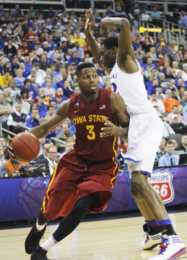 Senior forward Melvin Ejim works his way past a Kansas player during the second half of the Big 12 Championship semifinal game March 14 at the Sprint Center in Kansas City, Mo. The Cyclones defeated the Jayhawks 94-83.