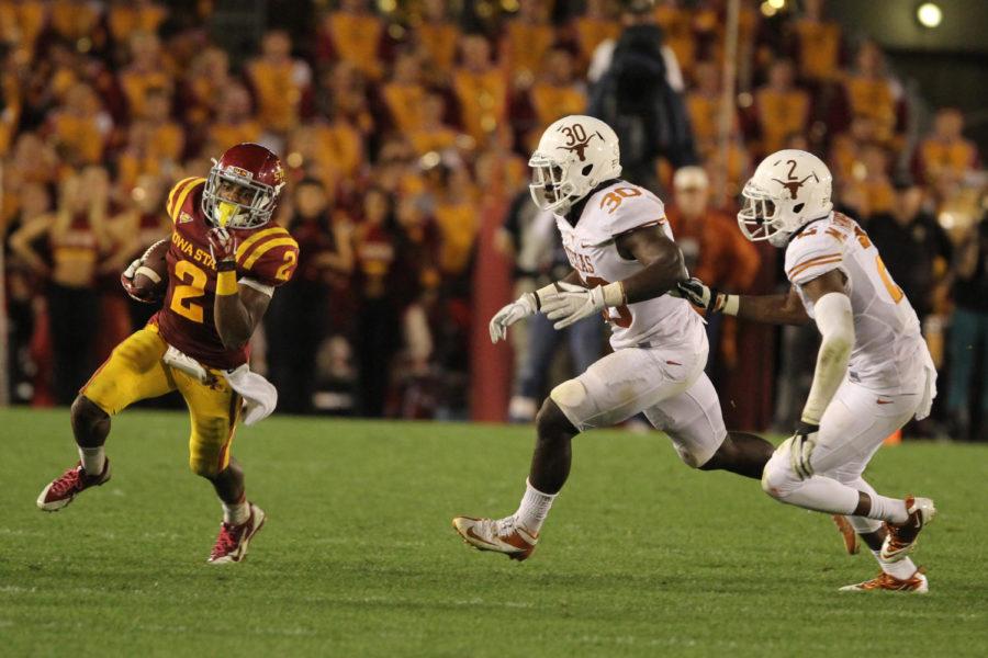 Junior running back Aaron Wimberly carries the ball during the game against Texas on Oct. 3, 2013, at Jack Trice Stadium. Wimberly had 123 rushing yards during the game.