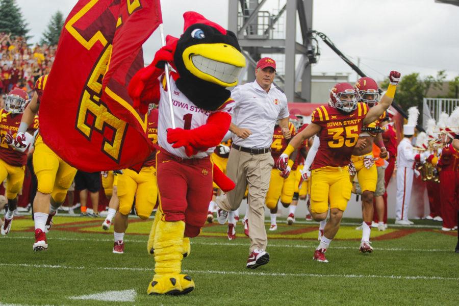 Cy+and+the+team+run+onto+the+field+before%C2%A0the+North+Dakota+State+game+Aug.+30%2C+2014+at+Jack+Trice+Stadium.+The+Cyclones+fell+to+the+Bison+14-34.