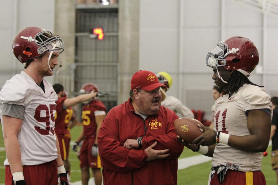 New Cyclone offensive coordinator Mark Mangino coaches players during the Cyclones spring football practice at the Bergstrom Football Complex on Monday, March 10.