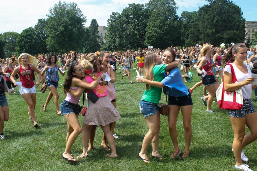 Students hug when they find out they are in the same chapter at bid day Aug. 21.