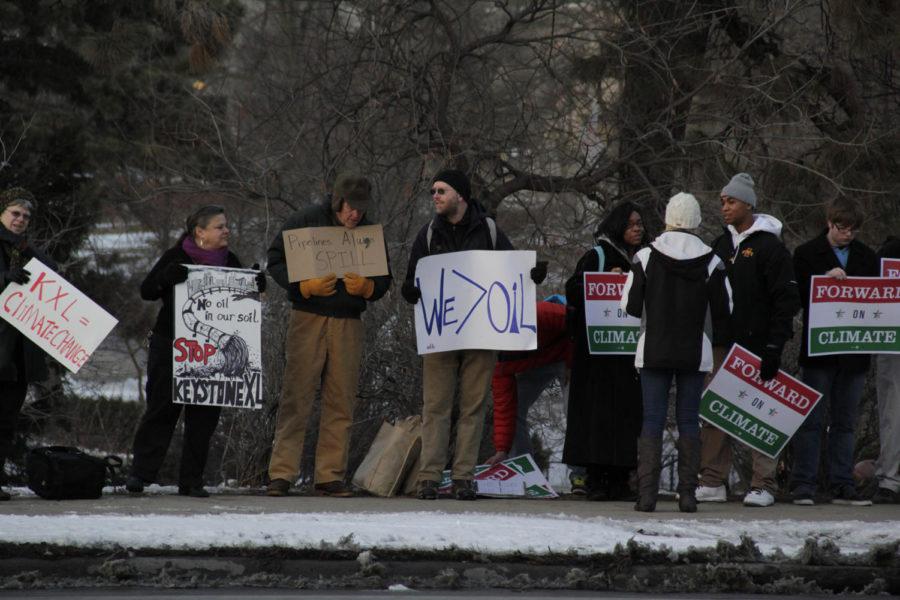 ISU students and community members protested the Keystone XL pipeline on the corner of Welch Avenue and Lincoln Way on Feb. 3, 2014. Around 30 people, including 11 students, stood in 27 degree weather for about an hour in protest of the pipeline expansion.