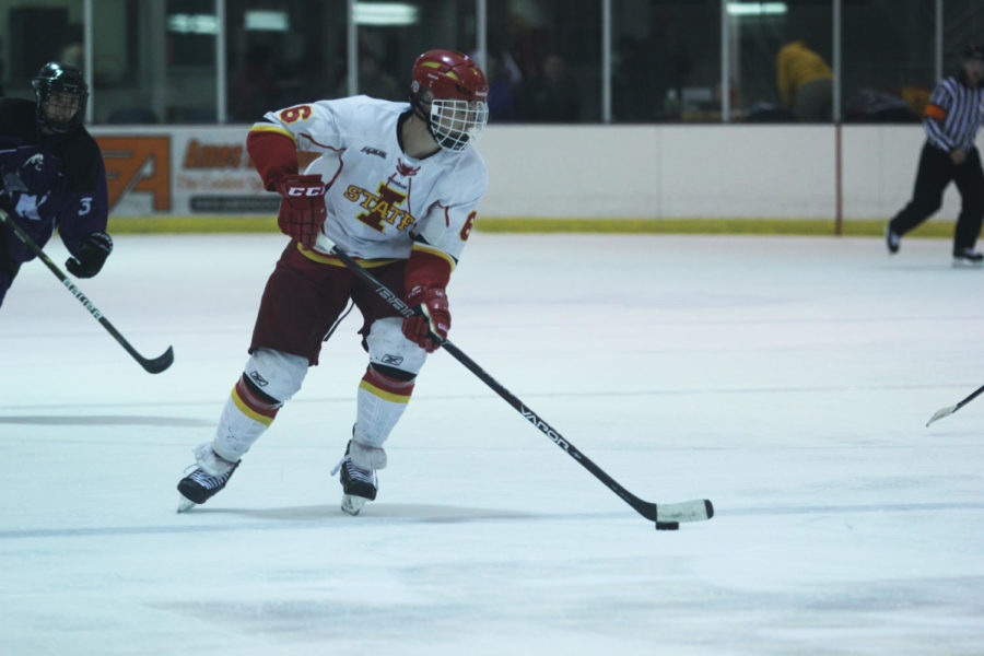 Junior defender Mike Dopko lines up to take a shot during the game against Waldorf on Sept. 13 at the ISU/Ames Ice Arena.