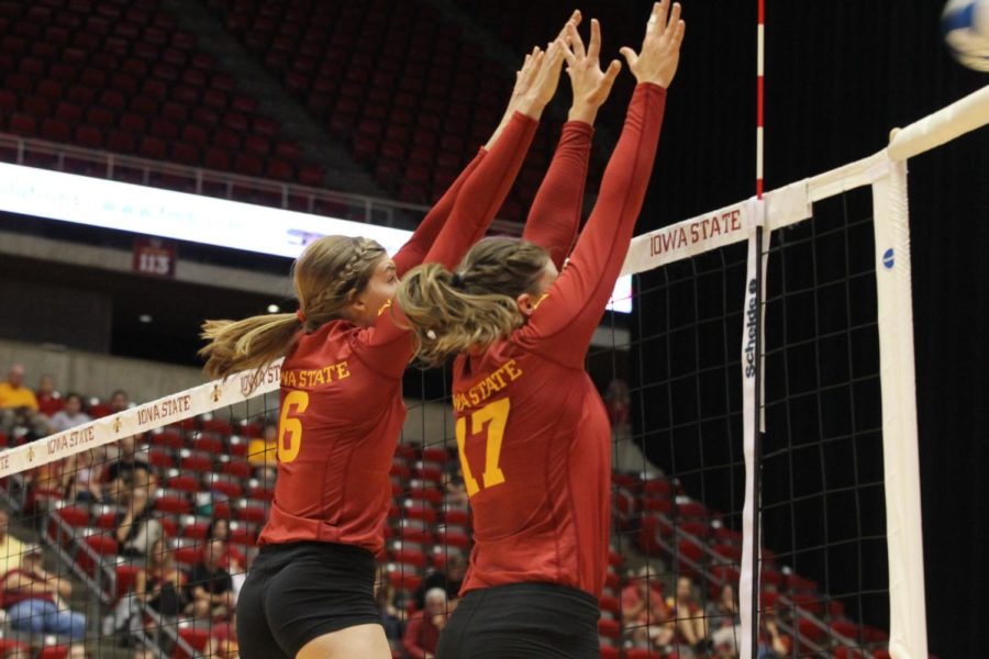 Outside hitter Alexis Conaway, left, and setter Suzanne Horner work together to block the Stanford hitters. Iowa State had a total of three blocks throughout the night on Aug. 29. 