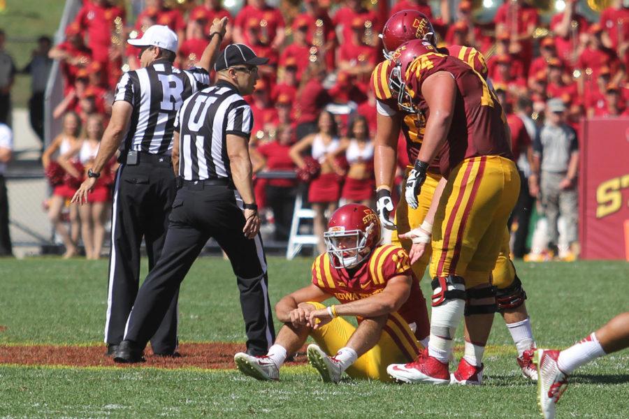 ISU quarterback Sam Richardson sits on the field after the final offensive play of the game against Kansas State. Richardson was tackled in the backfield, causing a turnover to the Wildcats. The Cyclones fell to the Wildcats with a final score of 32-28.