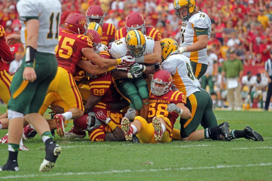 Iowa States defensive line tackles NDSU running back John Crockett during the North Dakota State game Aug. 30. The Cyclones fell to the Bison with a final score of 14-34.