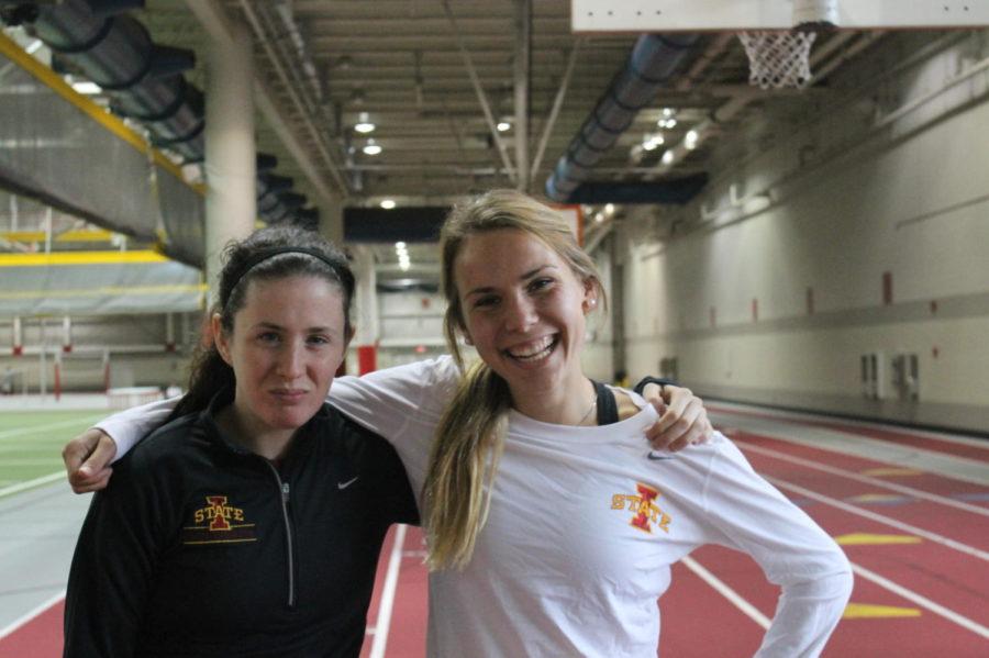 Freshmen Olivia Robertson and Evelyne Guay, the newest members of the ISU womens cross country team, pose together on the track in Lied Recreation Athletic Center.