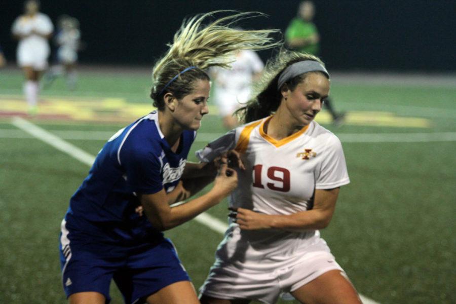 Sophomore midfielder Danielle Moore tries to gain control of the ball at the midfield during the game against Drake on Sept. 19 at the Cyclone Sports Complex . Iowa State beat Drake 2-0 with two early goals from Hayley Womack and Haley Albert.