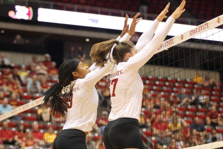 Middle blocker Samara West and setter Suzanne Horner use their height to block the Florida State hitters. West had one block during the match on Aug. 31. 