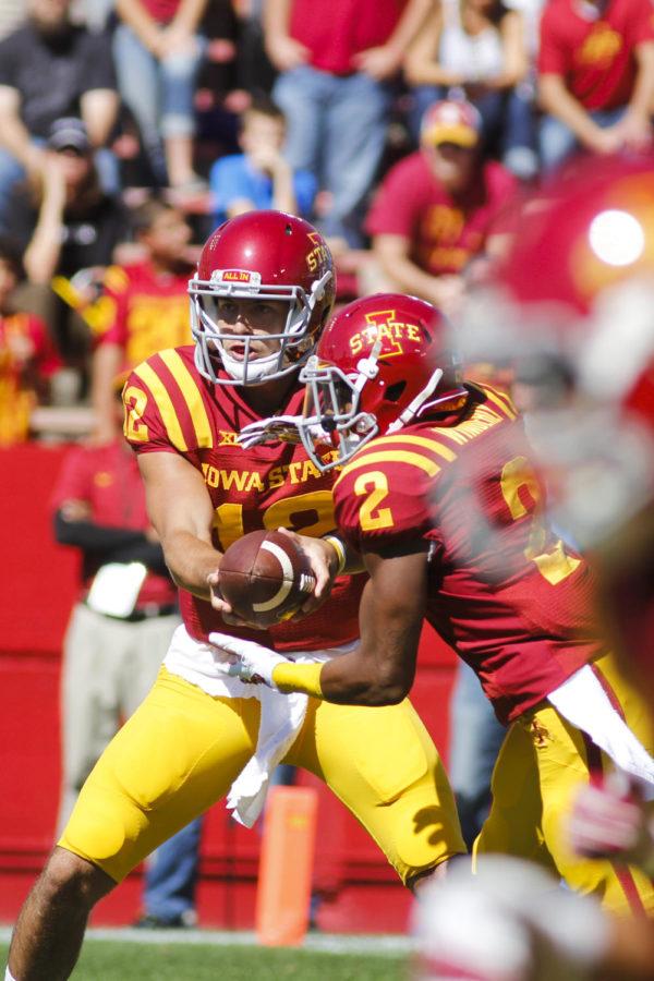 Redshirt junior quarterback Sam Richardson passes off the ball to senior running back Aaron Wimberly during the game against Kansas State on Sept. 6 at Jack Trice Stadium. The Cyclones led for much of the game but couldnt maintain their lead in the second half, and the Wildcats won 32-28.