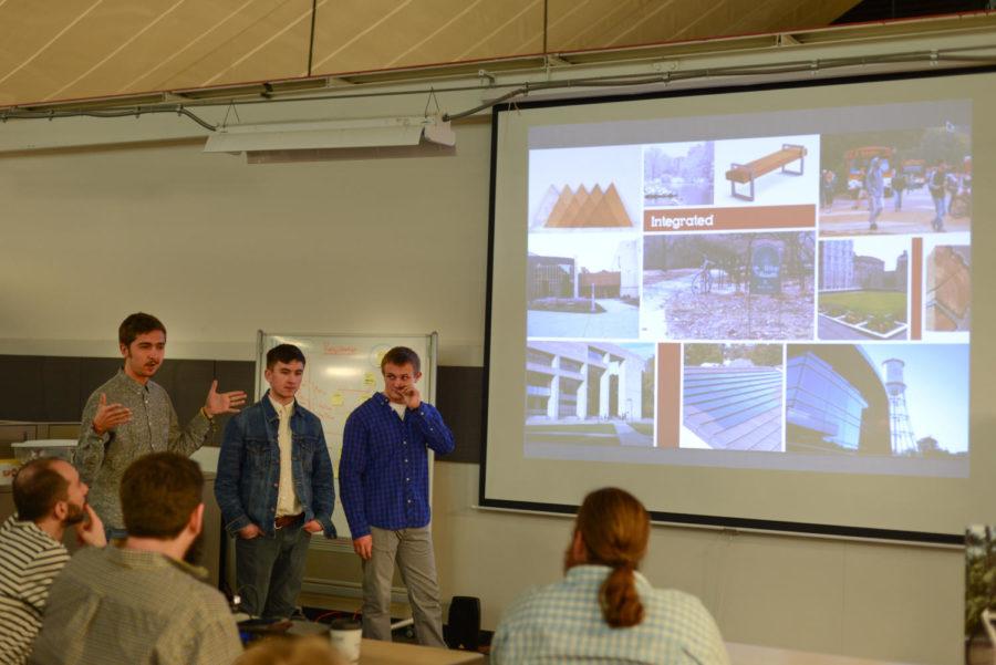 Travis Cannon, junior in industrial engineering, presents about the Cycle biking system for Iowa State on March 28 at industrial design student space in the Armory.