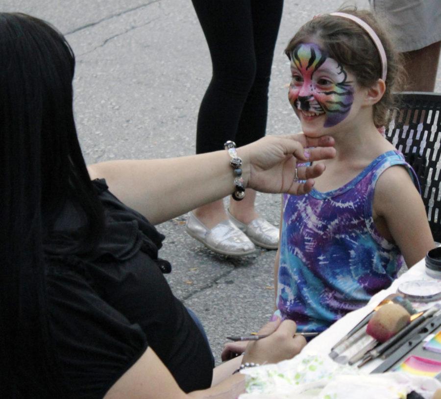 Joy Kath of Joyful Colorz Face Painting came to Campustown for Dinkey Day on Sept 26. Dinkey Day celebrates Ames through historical displays, booths showcasing several Iowa State student organizations, face painting, games and live entertainment.