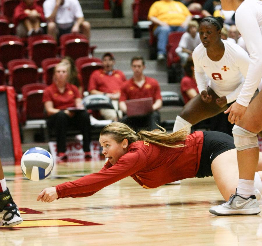 Junior libero Caitlin Nolan dives for the ball to save the point for Iowa State during a set against Northern Illinois in the Iowa State Challenge on Sept. 6. The Cyclones defeated the Huskies in three straight sets.