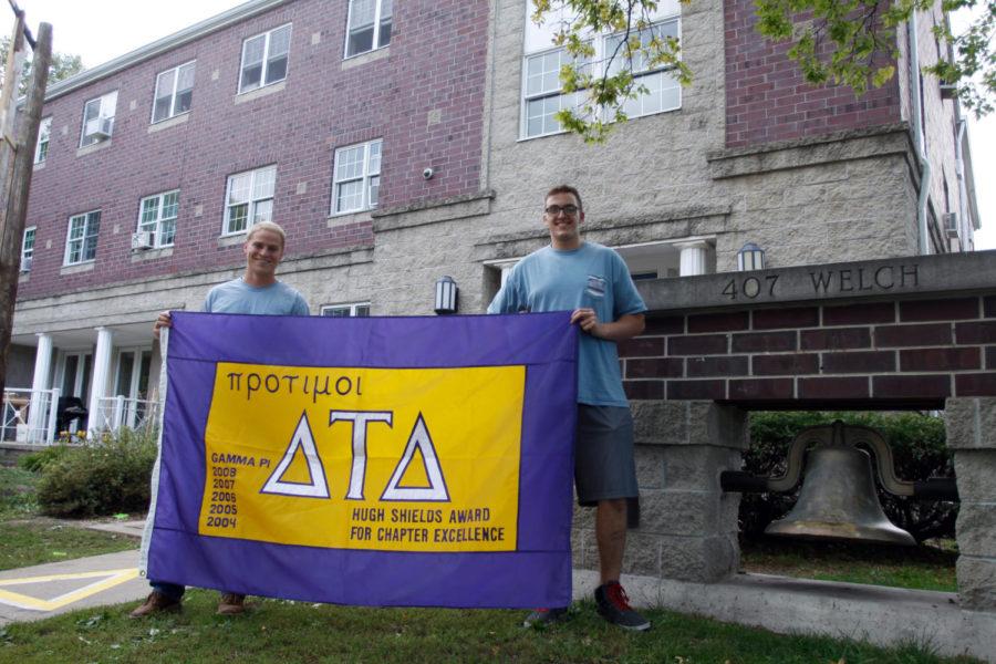 Corey+Anderson%2C+left%2C+senior+in+mechanical+engineering%2C+and+Will+Hyde%2C+freshman+in+pre-business%2C+%E2%80%94+both+members+of+the+Delta+Tau+Delta+fraternity+%E2%80%94+hold+the+Hughes+Shields+Award+outside+their+temporary+house+on+Welch+Avenue.+The+Hughes+Shields+Award+is+given+to+the+10+best+chapters+in+the+country.+The+ISU+chapter+of+Delta+Tau+Delta+has+won+this+award+more+than+any+other+chapter+in+its+fraternity.
