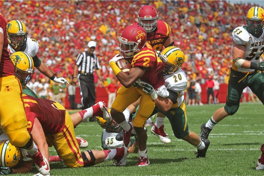 Iowa States running back Aaron Wimberly pushes through North Dakota States strong safety Colten Heagle to score a touchdown for the Cyclones during the game Aug. 30. The Cyclones fell to the Bison with a final score of 14-34.