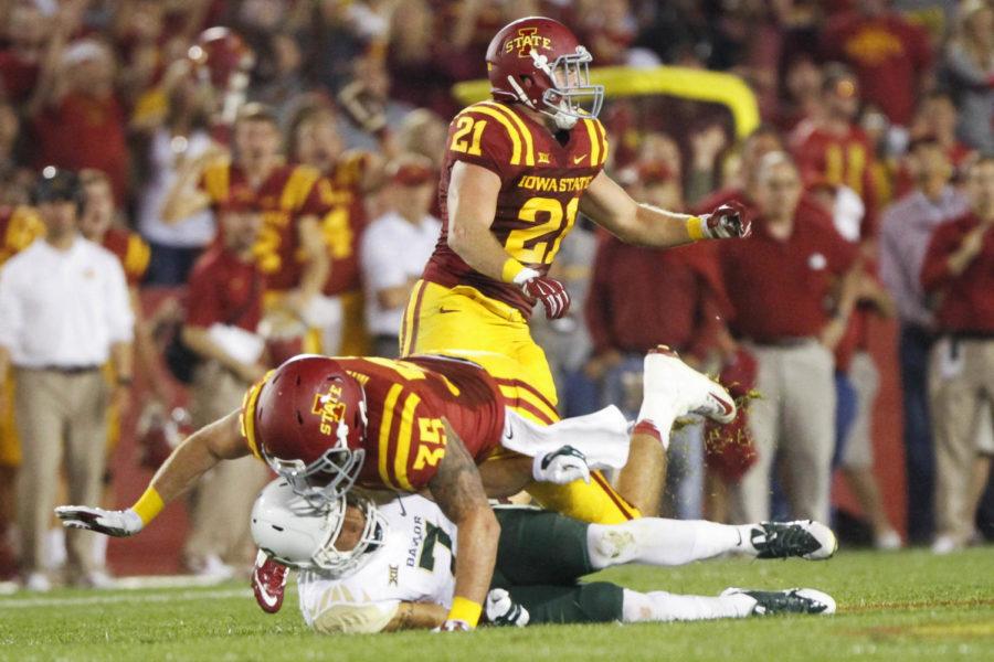 Linebackers Jevohn Miller and Luke Knott make a tackle against No. 7 Baylor on Sept. 27 at Jack Trice Stadium. The Cyclones fell to the Bears 49-28. Miller led the Cyclones in tackles with 17.