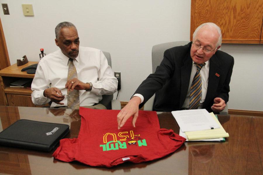 Tom Hill, senior vice president of Student Affairs, and Warren Madden, senior vice president for Business and Finance, look at the NORML ISU T-shirt during a meeting with the club. The shirt is the subject of controversy due to the logo of ISU mascot Cy being used, since the use of marijuana is illegal.
