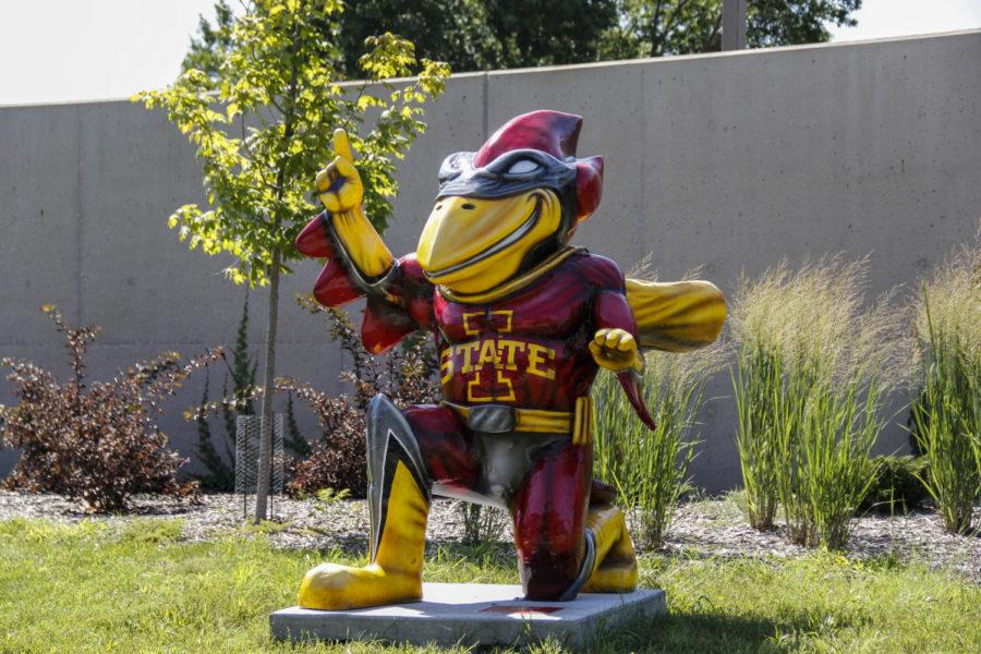 Iowa State and the Ames Chamber of Commerce partnered on the CyclONE City project to place 30 different versions of Cy around the city of Ames and campus. Super Cy, sponsored by Hy-Vee, stands outside Hilton Coliseum. The artist is Hugo Kenemer from Ames.