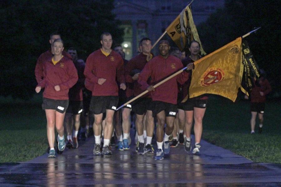 Student members of Iowa States Army ROTC continue their tradition of running the Cy-Hawk game ball the day before the Iowa Corn Cy-Hawk Series game. Due to adverse weather conditions, ROTC cut its early morning run short.
