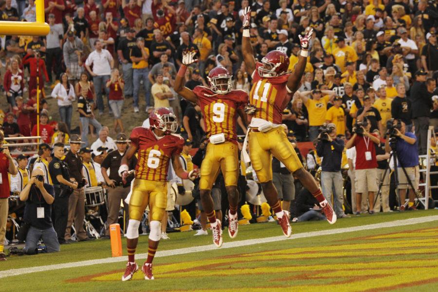 Redshirt sophomore wide receiver Tad Ecby, redshirt sophomore wide receiver Quenton Bundrage and junior tight end E.J. Bibbs celebrate the first touchdown of the game by Bundrage in the end zone against Iowa on Sept. 14 at Jack Trice Stadium. Bundrage scored all three Cyclone touchdowns but was clearly not enough in the 27-21 loss to in-state rivals.