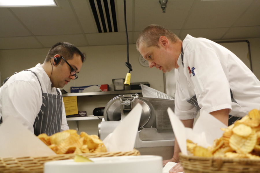 Scott Bruhn, right, executive chef for ISU Dining, plays an instrumental role in operations by leading the various chefs around campus. In the midst of catering a meal for the Board of Regents and ISU President Steven Leath, Bruhn oversees the presentation, quality and execution of special luncheons that ISU Dining hosts.