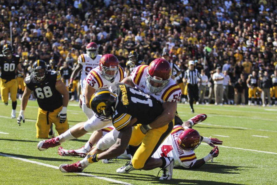 Senior defensive end Cory Morrissey takes down a University of Iowa player during the Iowa Corn Cy-Hawk Series game against Iowa on Sept. 13 at Kinnick Stadium in Iowa City. The Cyclones defeated the Hawkeyes 20-17.