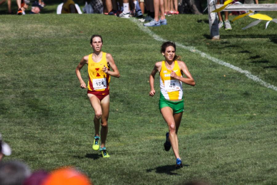 Crystal Nelson, left, races to a third-place finish at last years Roy Griak Invitational.