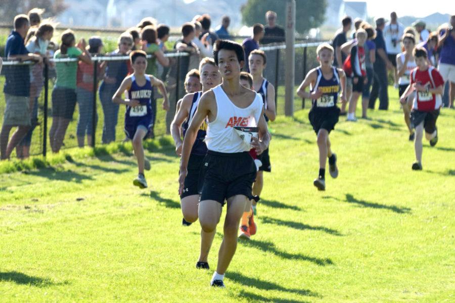 Seventh-grader Justin Tang sprints toward the finish line at the Timothy Jenks Memorial Invitational on Sept. 18 at the ISU cross country course.