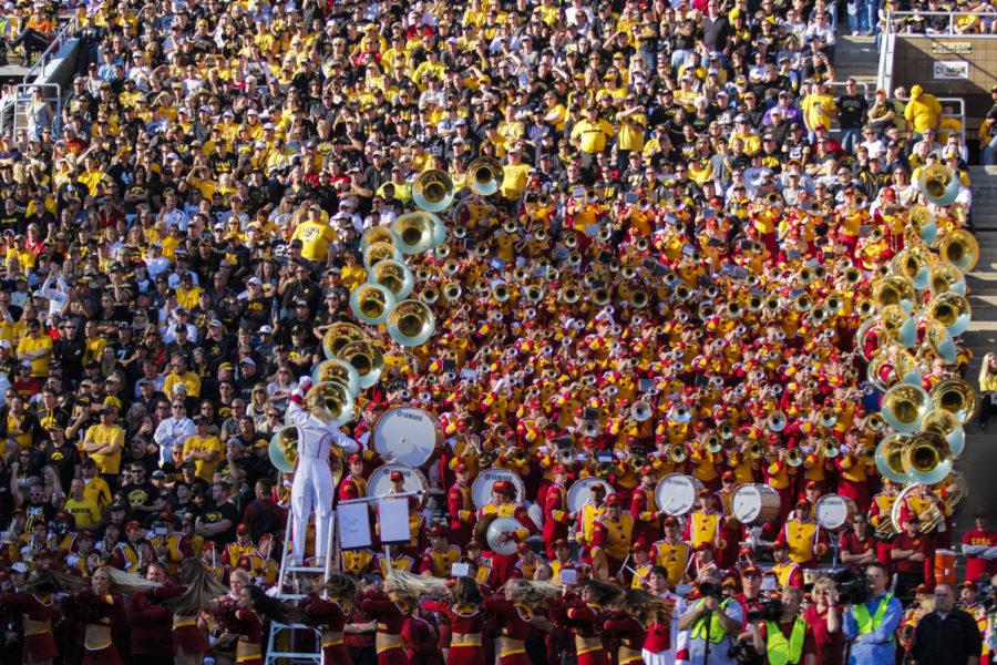 A sea of black and gold surrounds the ISU marching band during the Iowa Corn Cy-Hawk Series game against Iowa on Sept. 13 at Kinnick Stadium in Iowa City.