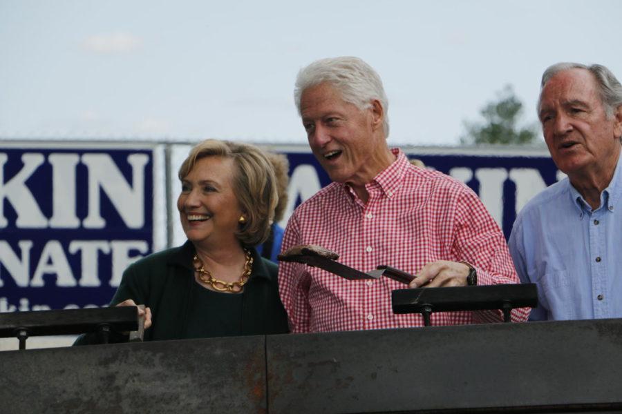 Bill and Hillary Clinton make their entrance with Sen. Tom Harkin at the 37th annual Harkin Steak Fry in Indianola, Iowa, on Sept. 14. This is the senator’s final steak fry as he ends his congressional career, vacating his Senate seat in January 2015.