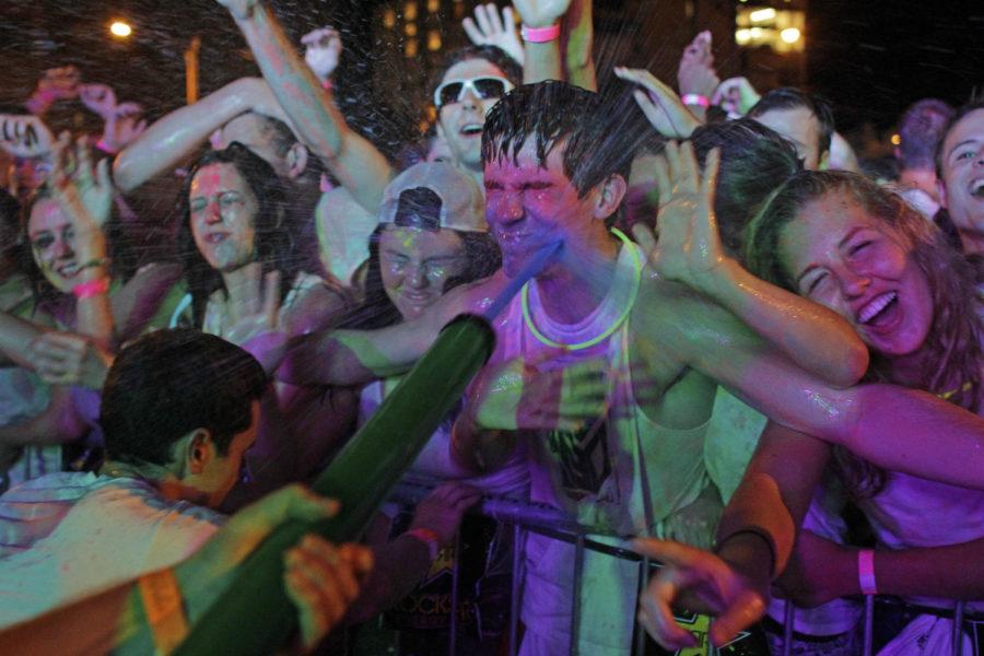 An attendee at Paint Bash is blasted in the face with water and paint during the concert. Seek Entertainment, a group of seven ISU students, put on Paint Bash, Ames first paint-based concert. The concert was sold out with more than 1,300 attendees showing up to 200 Stanton Ave.