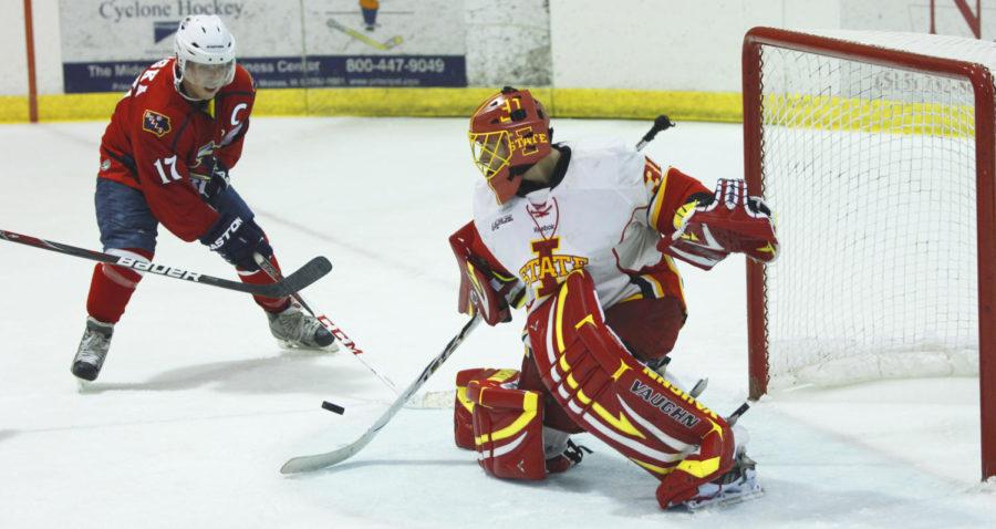 Junior goalie Matt Cooper defends a shot against North Iowa on Sept. 27 at Ames Ice Arena. Cooper only allowed two goals to pass him in the 4-2 victory.