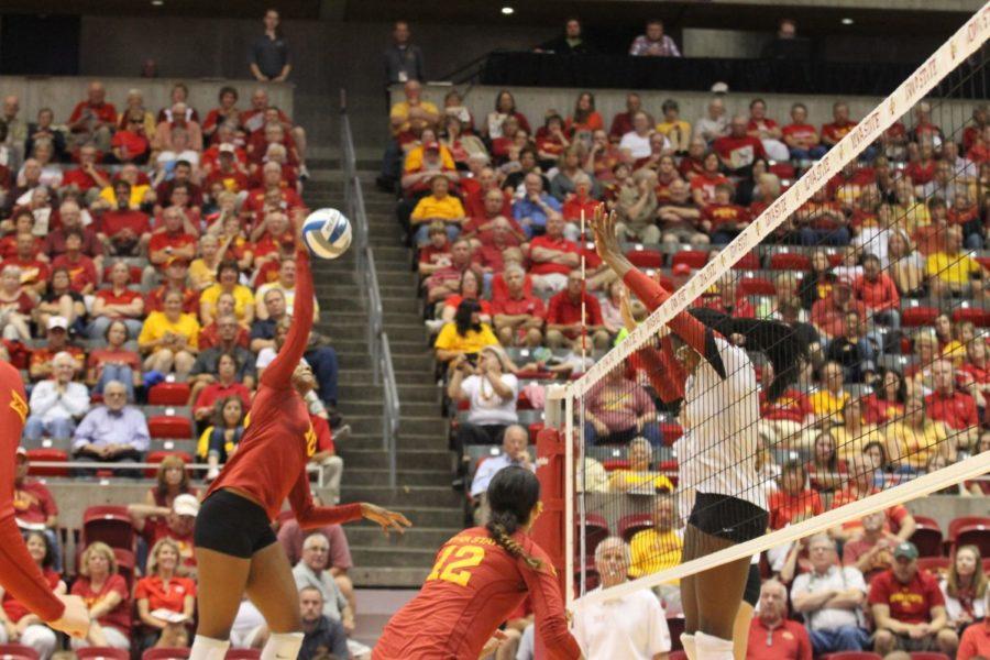 Outside hitter Victoria Hurtt spikes the volleyball at the Stanford players and earns a point for Iowa State. Hurtt also had two blocks against Stanford on Aug. 29. 