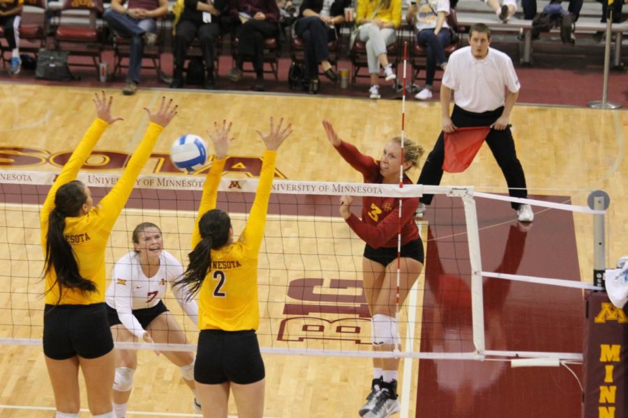 Redshirt sophomore outside hitter Morgan Kuhrt gets blocked by the Minnesota team in a 16-25, 20-25, 25-20, 23-25 loss. Kuhrt had 10 kills on Sep. 13. 