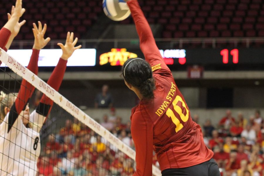 Outside hitter Victoria Hurtt positions her spike to avoid the Stanford blockers. Hurtt had 13 kills and was a powerful weapon for the Cyclones in the game on Aug. 29. 