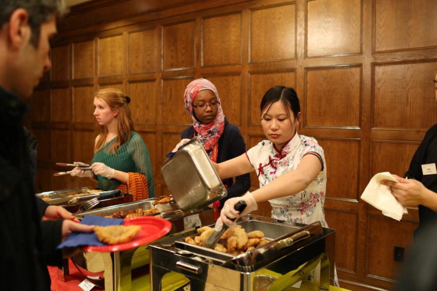 Savannah Putnam, junior in biology, Zaynab Diallo, junior in mathematics, and Liuran Fan, graduate student in human development and family studies, served food to a large audience. The food consisted of many culturally diverse selections. 