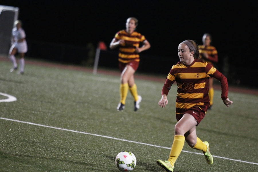 Senior midfielder Alyssa Williamson runs the ball for a pass in the Cyclones backfield. The Iowa State womens soccer team fell to No. 16 West Virginia 3-0 at their home match Oct. 17.