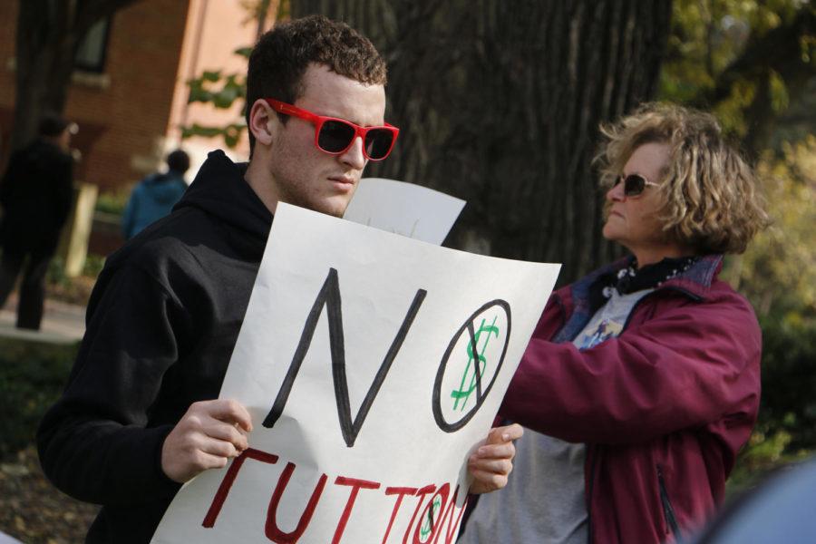 Joseph Lekowski, sophomore in horticulture, participates with a gathered crowd in front of Parks Library on Oct. 22 that rallied for action on student debt. The event was in conjunction with a similar event at the University of Iowa as the Board of Regents prepare to announce tuition policy for the coming year.