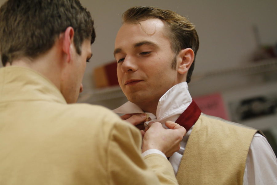 Actors prepare to go on stage by getting into costume for the Iowa State Theatre departments play, Spring Awakening, on Oct. 10, 2014.